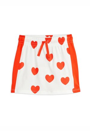 Falda blanca con estampados de corazones rojos, cintura elástica y cordón ajustable. Los paneles laterales son de color naranja, lo que agrega contraste al diseño. Tacto de tela suave.