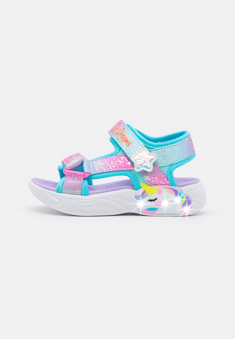 Colorful children's sandals with adjustable blue and pink straps, white sole, and unicorn design on the side, featuring glitter accents.