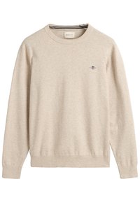 Beige gestrickter Pullover mit Rundhalsausschnitt, langen Ärmeln, gerippten Bündchen und Saum. Verfügt über ein kleines gesticktes Logo auf der Brust.