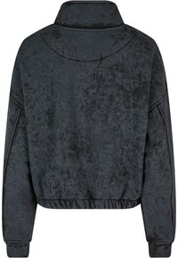 Tamsiai pilkas trumpas megztinis iš minkštos, tekstūruotos medžiagos. Turtingas aukštas color, elastingas juostos apvadas ir prigludę rankogaliai. Paprastas, funkciškai efektyvus dizainas.