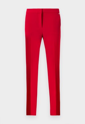 Bright red slim-fit trousers with a mid-rise waist and subtle side seam details, displayed against a plain white background.