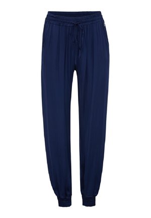 Pantaloni larghi blu navy con vita elastica e cordoncino, dotati di tasche laterali e polsini elastici alla caviglia.