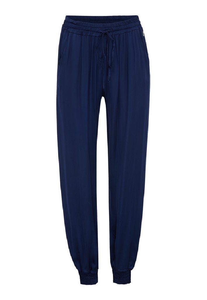 Marineblaue, locker sitzende Hose mit einem elastischen Bund und Kordelzug, seitlichen Taschen und elastischen Bündchen an den Knöcheln.