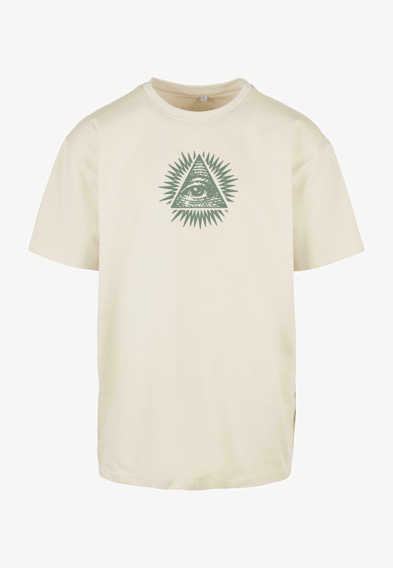 Beige short-sleeve T-shirt with a central All-Seeing Eye triangle design surrounded by radiating spikes in muted green.