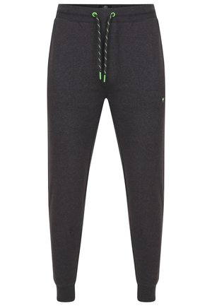 Dunkelgraue Jogginghosen aus weichem Material, mit kontrastierenden neon grünen Schnürsenkeln, schmaler Passform und gerippten Bündchen an den Knöcheln.
