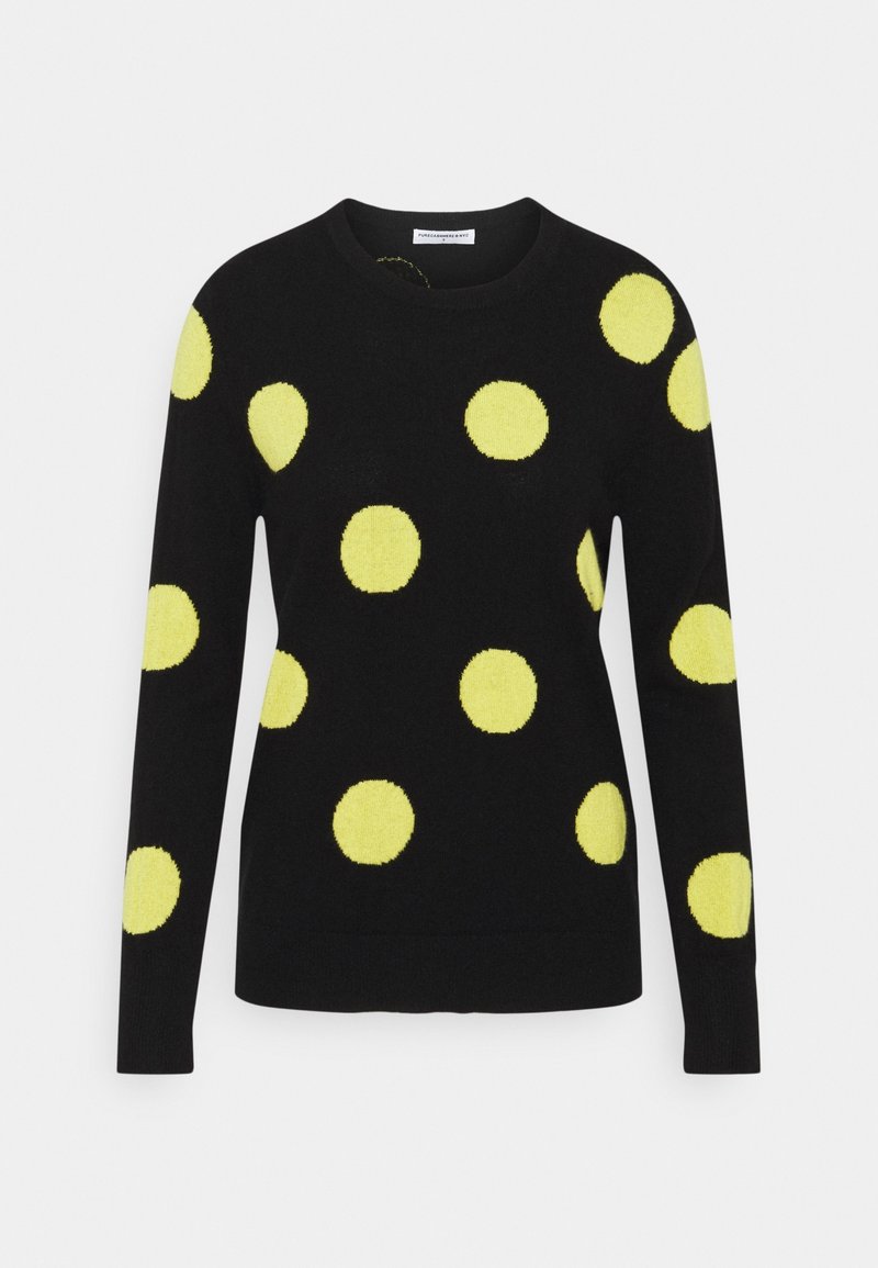 Pull noir à manches longues avec de gros pois jaunes répartis uniformément sur le devant, les manches et les épaules, avec un col rond.