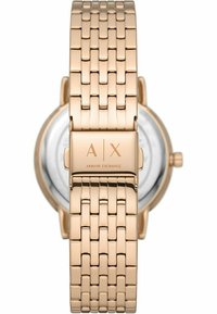 Guldtonad rostfridståls klocka med vävd armband, rund urtavla och genomskinlig skiva som visar minimalistiska timmarkörer och A|X-logotyp.