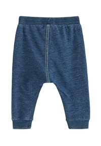 Jeansbyxor i en djupblå färg, med en ribbad midja och muddar, samt synlig söm längs mittsömmen.