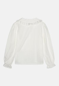 Hvit bluse laget av lett stoff, med volangkrage og mansjetter, lange ermer og en  avslappet passform.