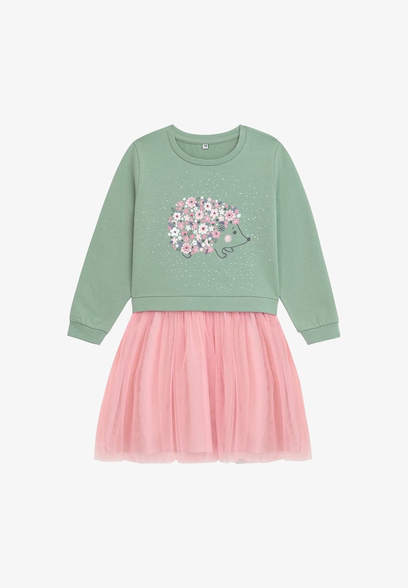 Haut vert à manches longues avec un hérisson en fleurs roses et blanches, associé à une robe jupe en tulle rose clair.
