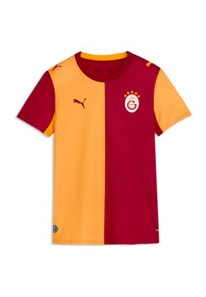 Kortærmet fodboldtrøje delt lodret med gul venstre side og rød højre side, med Puma-logo og Galatasaray-holdets våbenskjold med stjerner.