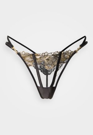 Tanga en dentelle noire avec motif floral doré, comprenant un mesh transparent, des bretelles réglables et des accents en métal doré.