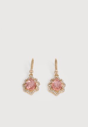 Gold drop earrings with teardrop pink gemstones surrounded by small clear crystals on a white background.