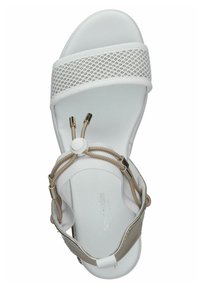 White sandal featuring a mesh strap, beige accents, and a round adjustment button. The sole is smooth with slight curvature for comfort.