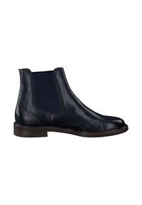Les bottines Chelsea en cuir noir présentent une finition lisse, des panneaux latéraux élastiques, des détails brogués et un petit talon empilé.