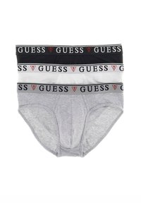 Drei Herren-Slips in Schwarz, Weiß und Grau. Jeder hat einen weichen elastischen Bund mit der Aufschrift "GUESS" in Schwarz und Rot.