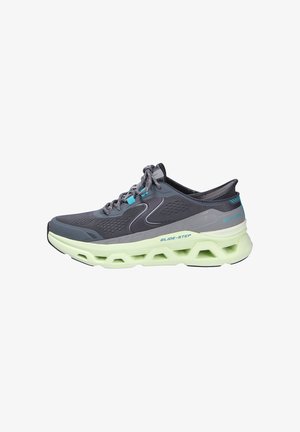 Gray athletic shoe with a breathable mesh upper, turquoise accents, and a thick, cushioned mint green sole featuring cut-out sections.