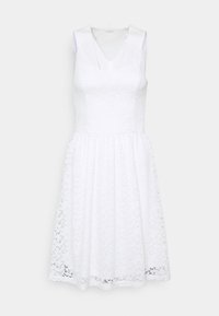 White lace dress with a fitted bodice, A-line skirt, and satin straps. Features floral patterns and a textured finish at the hemline.