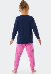 Two-piece child’s pajama set with a navy long-sleeve top and pink pants featuring star and swirl patterns. Soft fabric, relaxed fit.