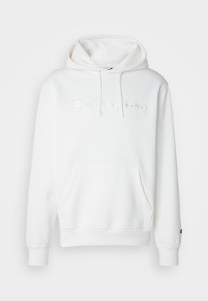 White pullover hoodie made of soft fabric. Features a front pocket, drawstring hood, and embroidered "Champion" logo. Cuffs are ribbed.