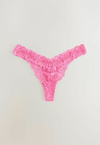 Pink lace thong with floral patterns, featuring scalloped edges and a sleek, minimalistic cut. The fabric is delicate and semi-transparent.