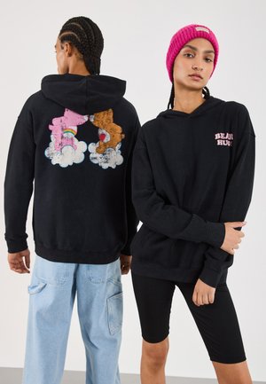 Black hooded sweatshirt featuring a colorful bear graphic on the back and "BEAR HUGS" text on the front. Fabric appears soft and casual.