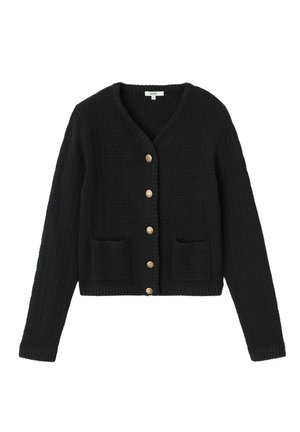 Cardigan noir court en tissu texturé, col en V, boutons dorés et deux poches frontales. Manches longues et ajustées.