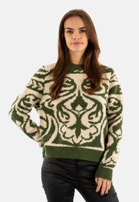 Maglione lavorato a maglia con una base avorio e intricate fantasie floreali verdi, colletto rotondo e polsini a coste. Materiale morbido e texture.