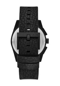 Reloj negro con una correa de goma texturizada, que cuenta con una hebilla negra mate y una caja octagonal con una esfera redonda y clara.