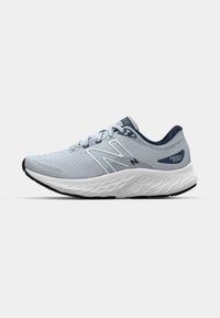 Light blue athletic shoe with a breathable mesh upper, rounded toe, cushioned white midsole, and dark rubber outsole. Features a navy accent.