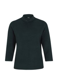 Pull vert foncé à manches longues avec un col montant orné de petits clous décoratifs autour du col. Texture de tissu lisse.