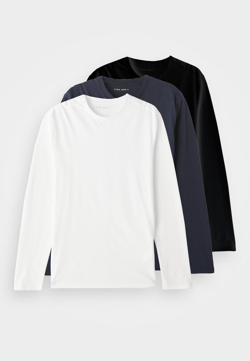 Three long-sleeve T-shirts stacked: one white, one dark navy, and one black. Made of smooth cotton, featuring round necklines and side slits.