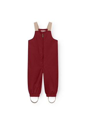 Red waterproof overall with beige adjustable straps, front zip closure, elastic cuffs, and circular accents at the ankles. Smooth texture.