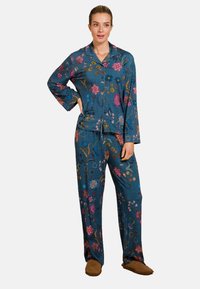 Floral-patterned, blue pajama set with long sleeves and pants, featuring vibrant pink, yellow, and green embroidery details. Soft fabric texture.