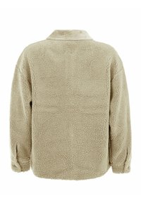 Veste en polaire beige avec une surface texturée, dotée d'un col et de poignets à boutons. Le dos est lisse sans coutures visibles.