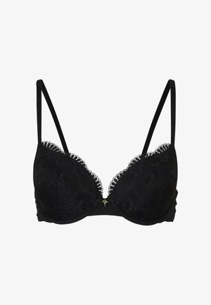 Black lace bra with molded cups, scalloped edges, adjustable straps, and a small gold accent at the center. Soft fabric and structured design.