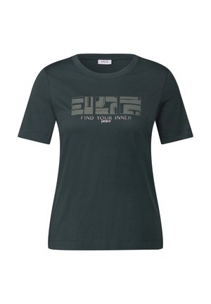 T-shirt in cotone verde scuro con maniche corte, caratterizzato da un design grafico geometrico e dal testo "Cerca la tua pace interiore" in colore chiaro.
