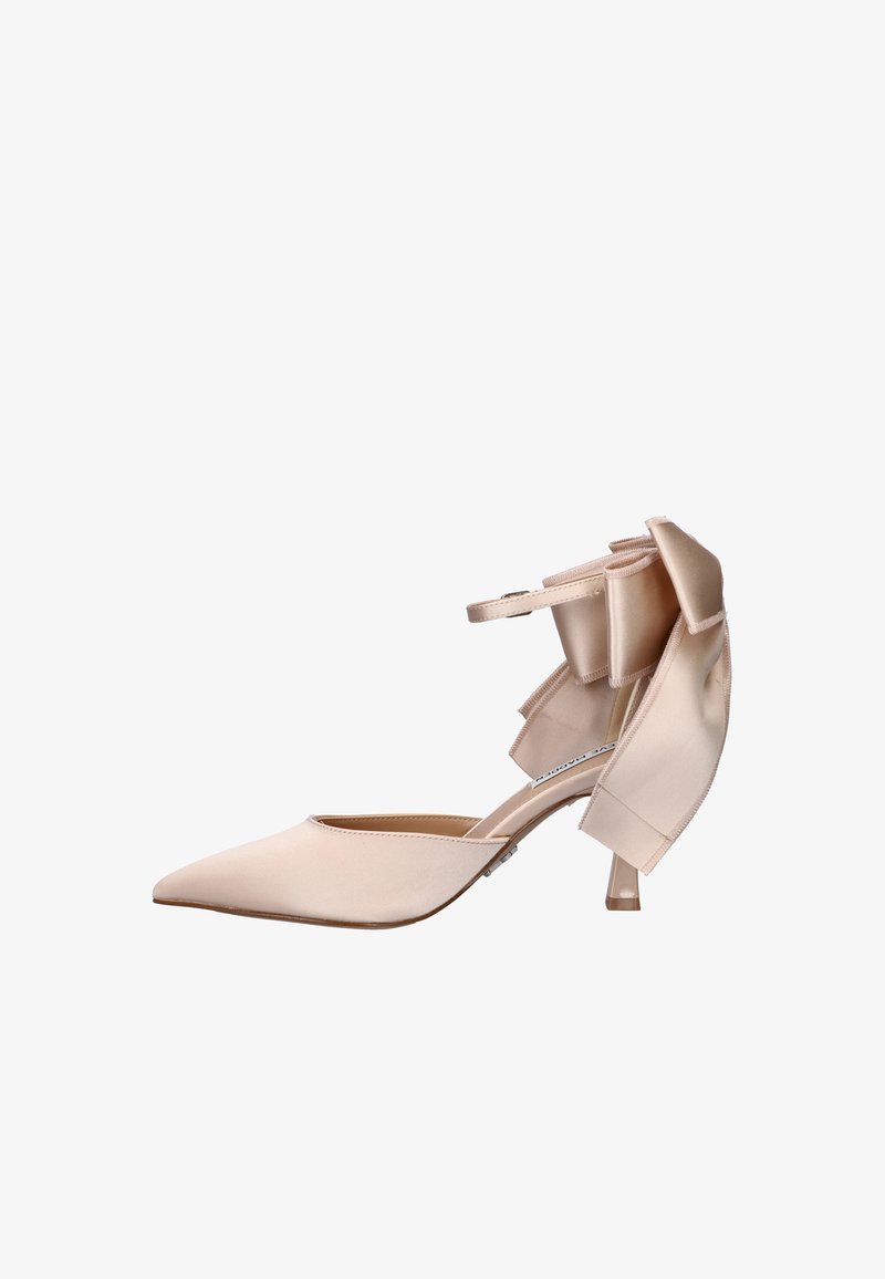 Beige satin pointed-toe high heel shoe with ankle strap and large decorative bow at the back, side view on white background.