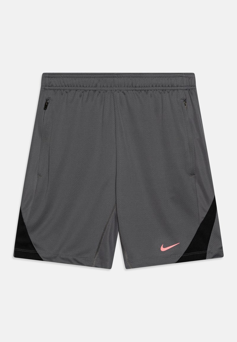 Pantalones cortos deportivos grises con detalles negros, tela ligera, cintura elástica, bolsillos laterales con cremallera y un logo de Nike rosa en la parte frontal derecha.