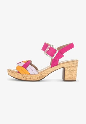 Multicolored sandal featuring pink, orange, and lavender straps. Has a cork-textured platform and block heel with a silver buckle.