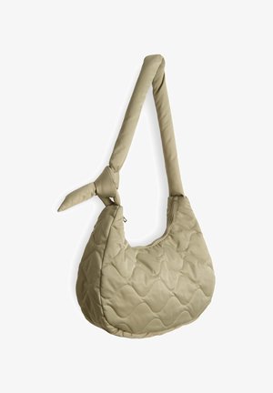 Gepolsterte beige Schultertasche mit runder Form, geknotetem Tragegurt und Reißverschlussverschluss. Besitzt ein strukturiertes Wellenmuster auf der Oberfläche.