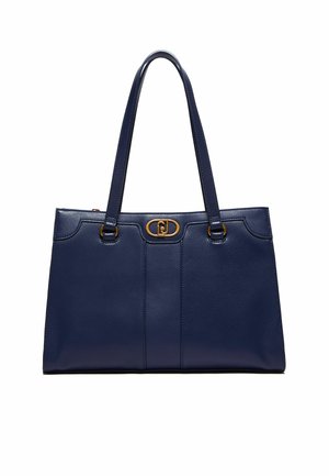 Bolsa tote de cuero azul marino con dos asas, herrajes dorados y un diseño estructurado que presenta acentos cosidos y un logotipo prominente en el centro.