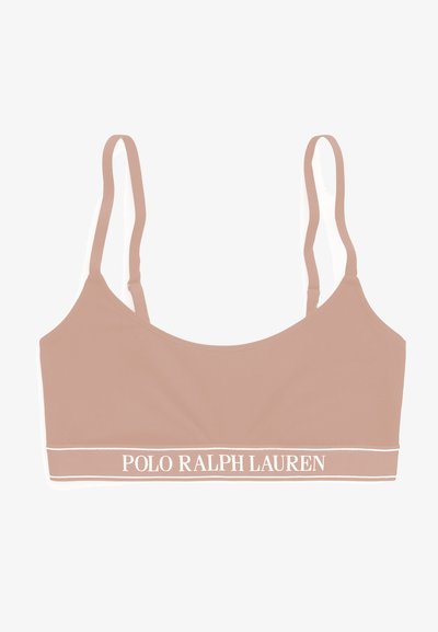 Polo Ralph Lauren bralette i lys tan med tynde justerbare stropper og et hvidt logo bånd i bunden. Glat stofoverflade.
