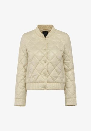 Pikowana jasnobeżowa kurtka z okrągłym dekoltem, napami i prążkowanymi mankietami oraz hemem. Posiada diamentowy wzór i gładką fakturę.