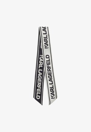 Čierna a biela hodvábna stužka s nápisom "KARL LAGERFELD" vytlačeným tučnými písmenami. Dlhý, plochý dizajn s špicatými koncami a kontrastnými okrajmi.