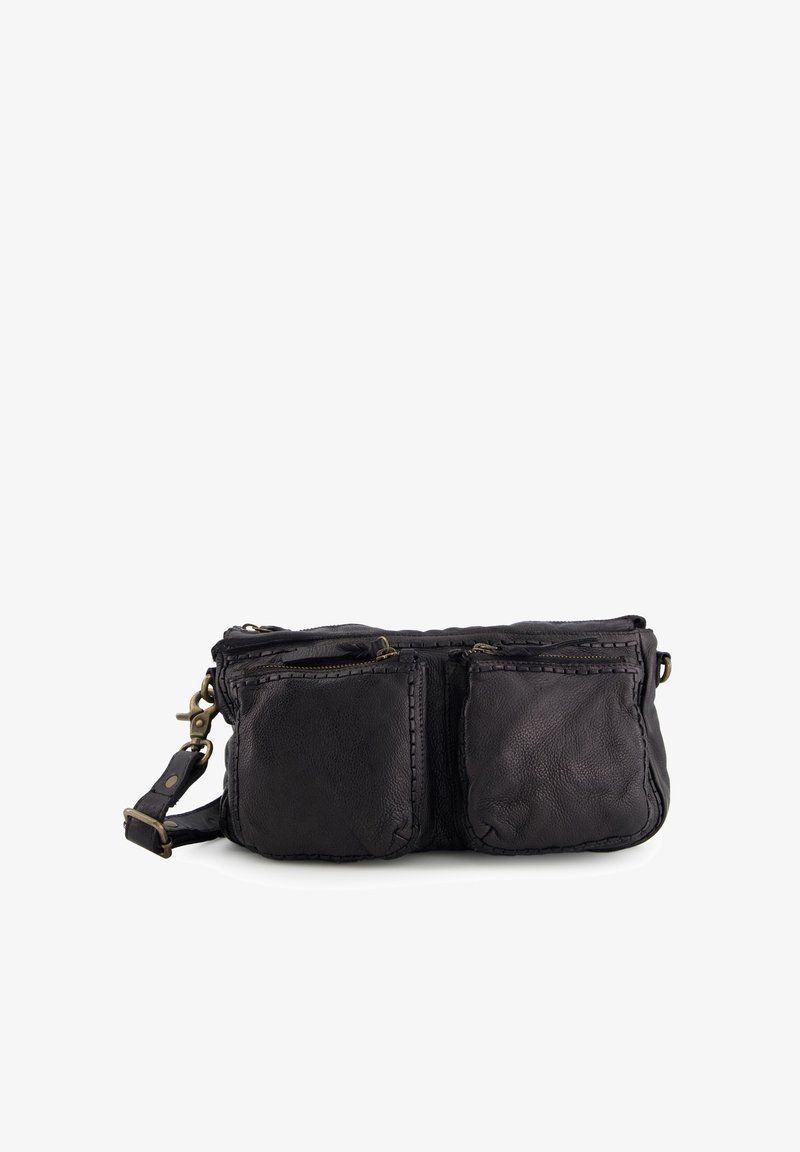 Black leather crossbody bag with two front zippered pockets, raw edges, and adjustable strap; textured surface and brass hardware accents.