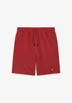 Shorts rouges arrivant aux genoux avec une taille ajustable à cordon, des poches latérales et un petit logo d'oiseau jaune sur la jambe gauche.