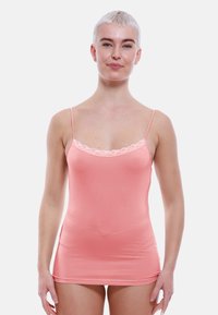 Peach camisole with thin straps, lace trim along the neckline, soft fabric, fitted design, and smooth texture.