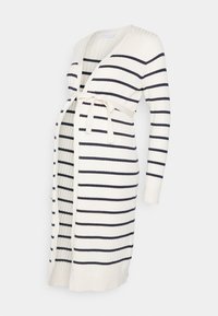 Graviditetströja i ribbad stickning, med marinblå ränder på krämfärgad botten. Öppen framsida med lång ärm och knytband.