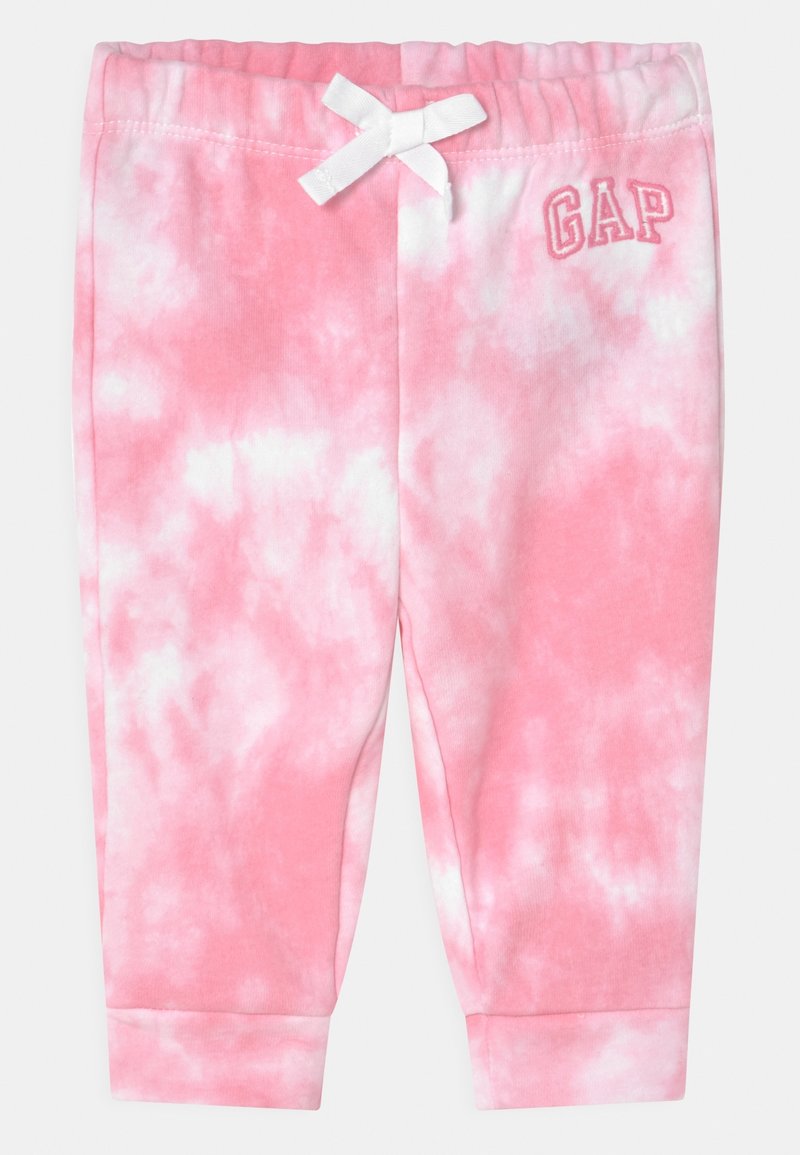 Pantalon bébé tie-dye rose et blanc avec taille élastique, nœud blanc, chevilles à revers et logo GAP sur la hanche gauche.